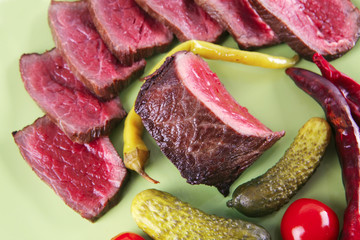 red beef slices on green dish