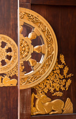 Deer carved gold paint on temple door