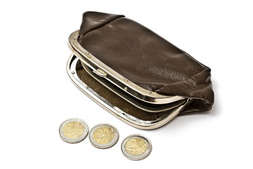 Old purse and euro coins