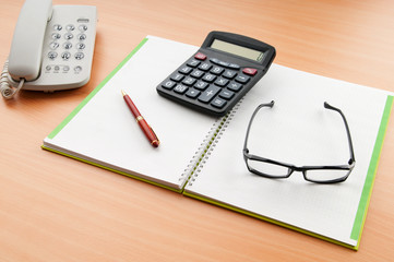 Business concept with notepad and calculator