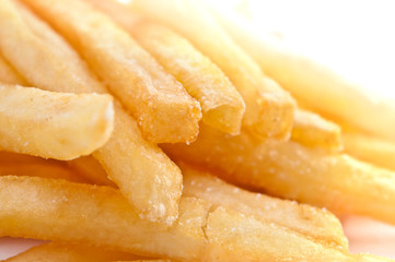 Fries french potatoes closeup isolated on white