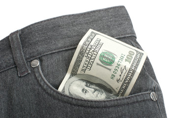 One hundred dollar banknote in pocket of trousers on white