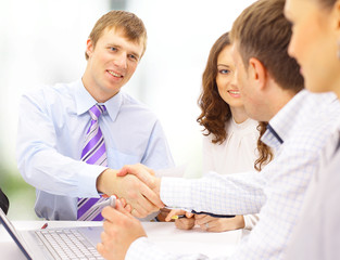 Business people shaking hands, finishing up a meeting