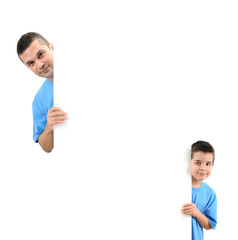 Father and son behind a blank board for your text isolated.