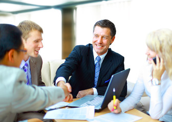 Business people shaking hands, finishing up a meeting