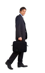 Full lenght mature businessman going to work.White background