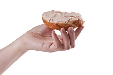 Sandwich with paste in a hand