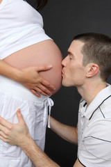 Husband Kissing Pregnant Wife