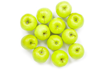 Green and yellow apples on a white baclground