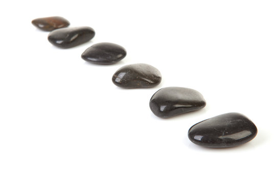 Black Stepping Stones In A Row Over White Background