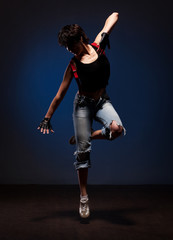 Fototapeta na wymiar Dancing woman in street style