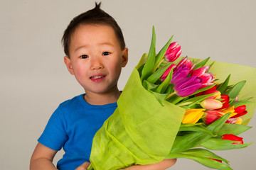 Asian boy with flowers