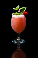 Glass of Courtesan coctail drink with green mint and strawberry