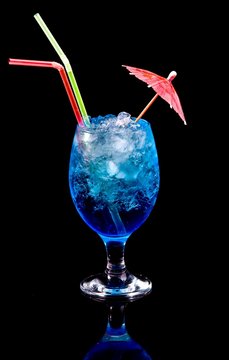 Coctail Blue Lagoon With Straw And Umbrella