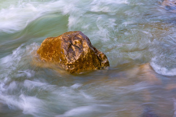 wet stones in run of mountain stream