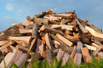 Pile of fire wood   on blue sky background