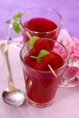 clear beet soup in glass