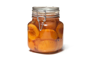 Jar of pickled peaches