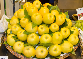 fresh yellow apples at a fruit market