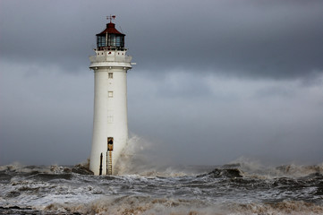 Waves slap against New Brighton lighthouse on the river mersey