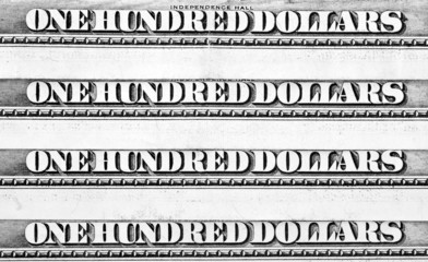 Row of one hundred dollars banknotes