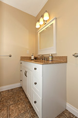 White cabinet with sink in bathroom