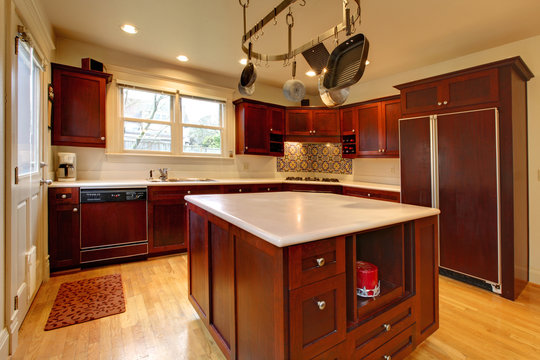 Luxury cherry kitchen with pot rack and island