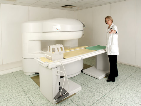 Young MD in MRI Scanner room