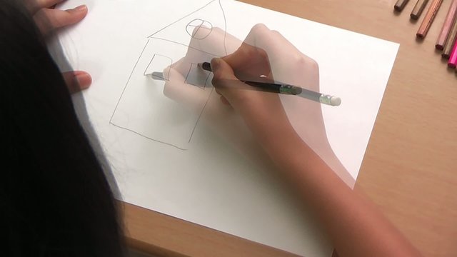 girl drawing a house
