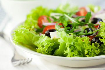 Fresh vegetable salad with feta and olives