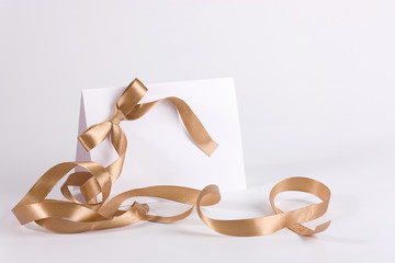 Empty invite with golden ribbon