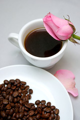 Cup of coffee with heart from coffee beans