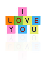 Phrase I LOVE YOU formed from wooden letter blocks