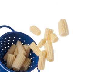 Baby Corn Spilling from a Blue Colander Border