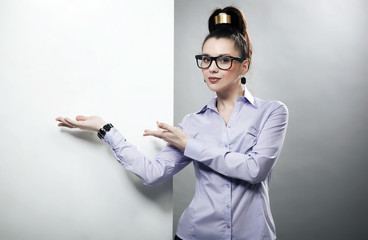 Portrait of a businesswoman pointing at the whiteboard
