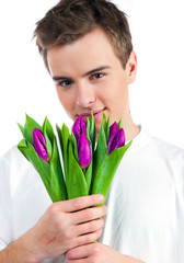 Cute young men give the flowers