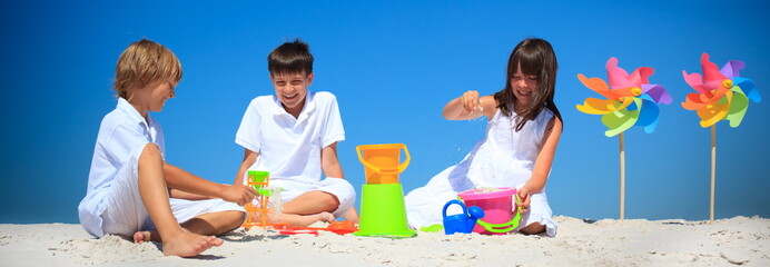 Children playing in beach sand