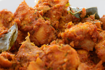 Close-up of a dish of spicy Rendang chicken