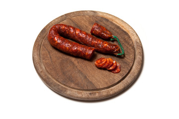 Spanish Chiriso sausage isolated on a white studio background.
