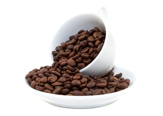 white cup with coffee beans