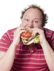 homme boulimique dévorant un sandwich