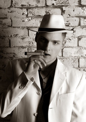Mafia man with cigar. Gangster