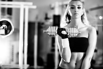 Young woman weight training