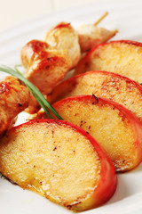 Chicken skewer and baked apple