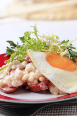 White beans with sausage and fried egg