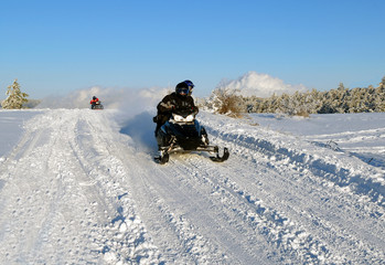 mans goes on a snowmobile