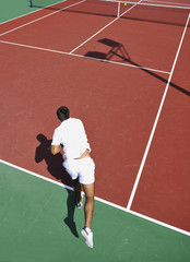 young man play tennis outdoor