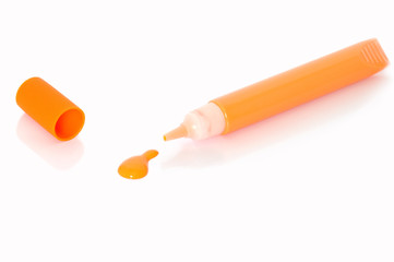 a tube of orange paint