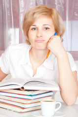 young woman reads  book.