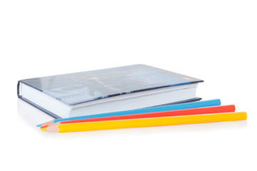 notebook with colored pencils